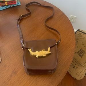 Brown alligator long strap use as a shoulder bag or cross body.